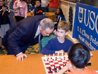 Chess grandmaster Garry Kasparov and 11-year-old Daniel Gurevich. 